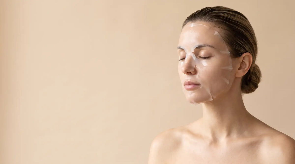 A woman relaxing with eyes closed while wearing a clear hydrogel mask